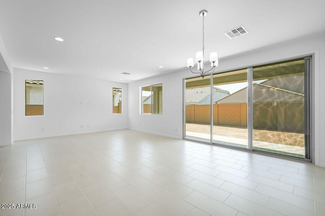 14323 West Alameda Road Surprise, AZ 85387 - Photo 6 of 56 a view of an empty room with glass door