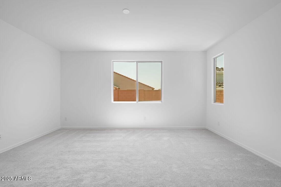 14323 West Alameda Road Surprise, AZ 85387 - Photo 10 of 56 an empty room with a window
