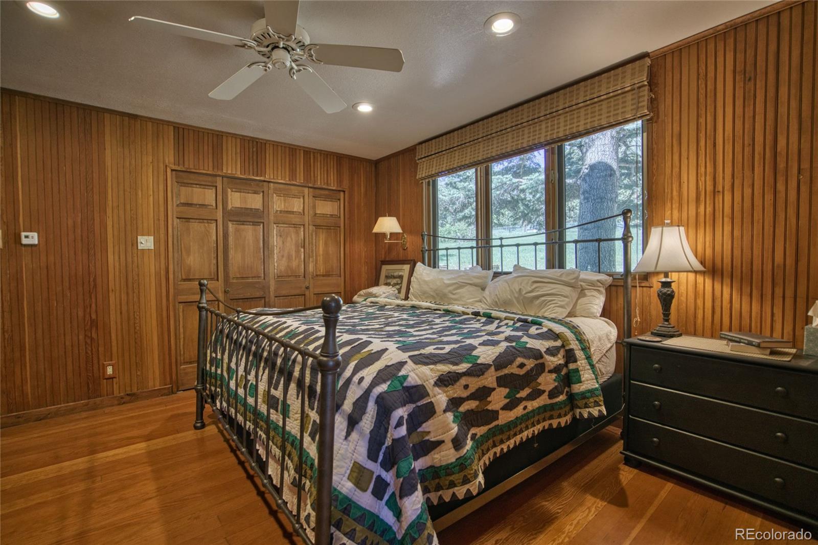 8555 Cuerna Verde Road Rye, CO 81069 - Photo 12 of 35 a bed sitting in a spacious bedroom next to a window