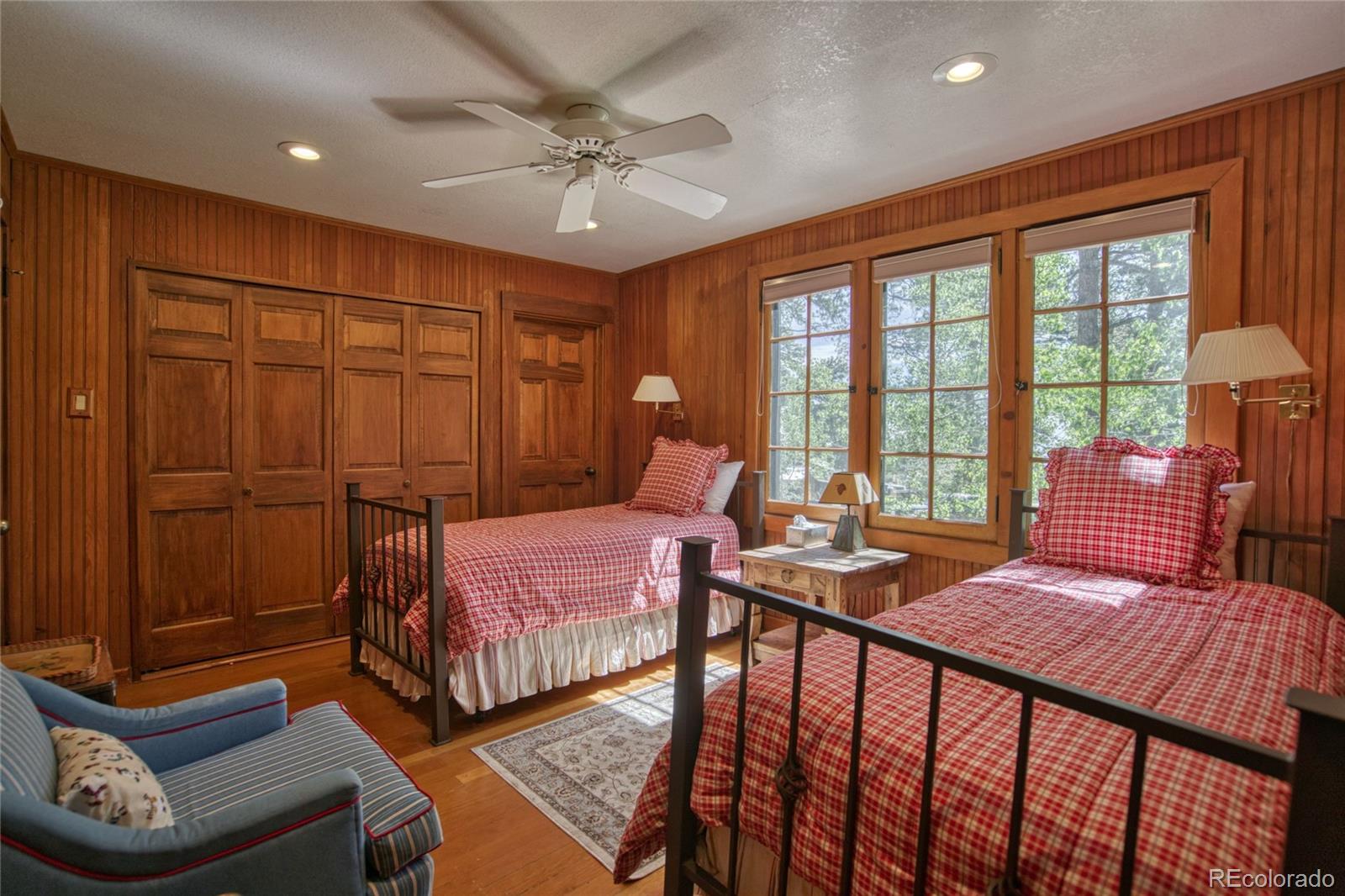 8555 Cuerna Verde Road Rye, CO 81069 - Photo 16 of 35 a bedroom with a bed and wooden floor