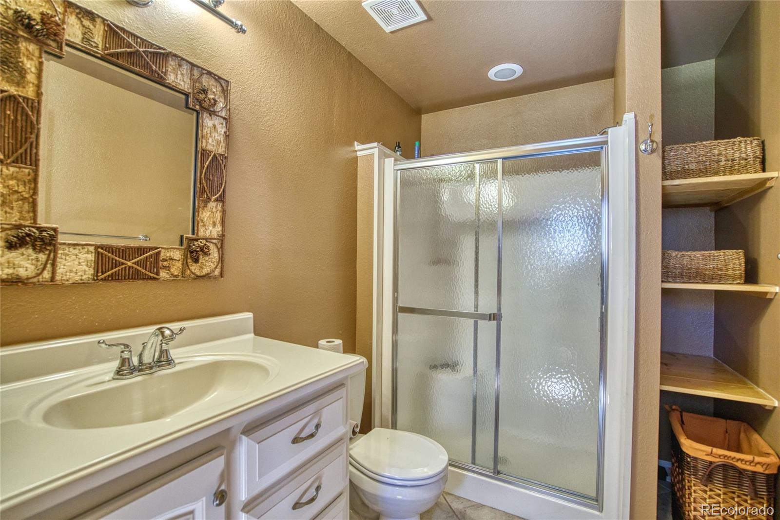 8555 Cuerna Verde Road Rye, CO 81069 - Photo 23 of 35 a bathroom with a sink toilet and shower