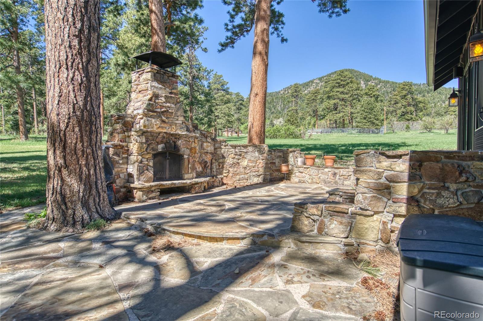 8555 Cuerna Verde Road Rye, CO 81069 - Photo 25 of 35 a view of a backyard with a garden and trees