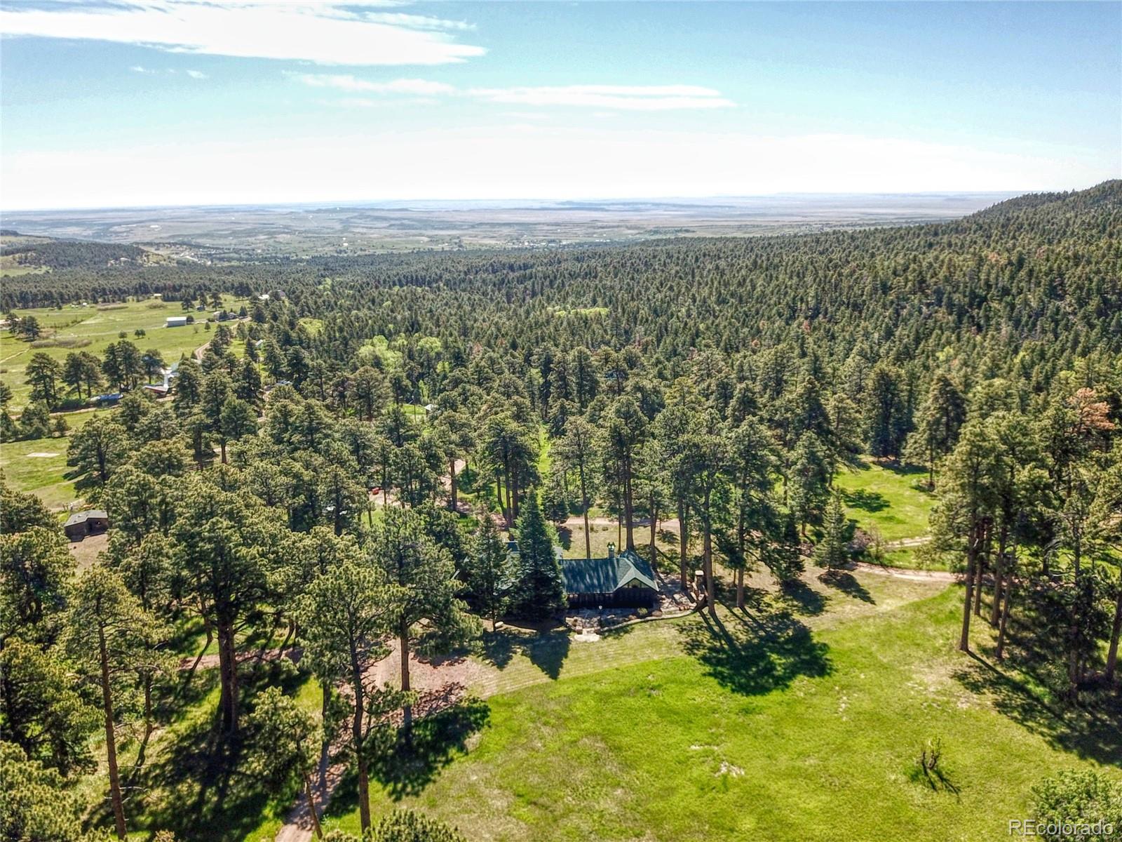 8555 Cuerna Verde Road Rye, CO 81069 - Photo 29 of 35 a view of a city with lush green forest
