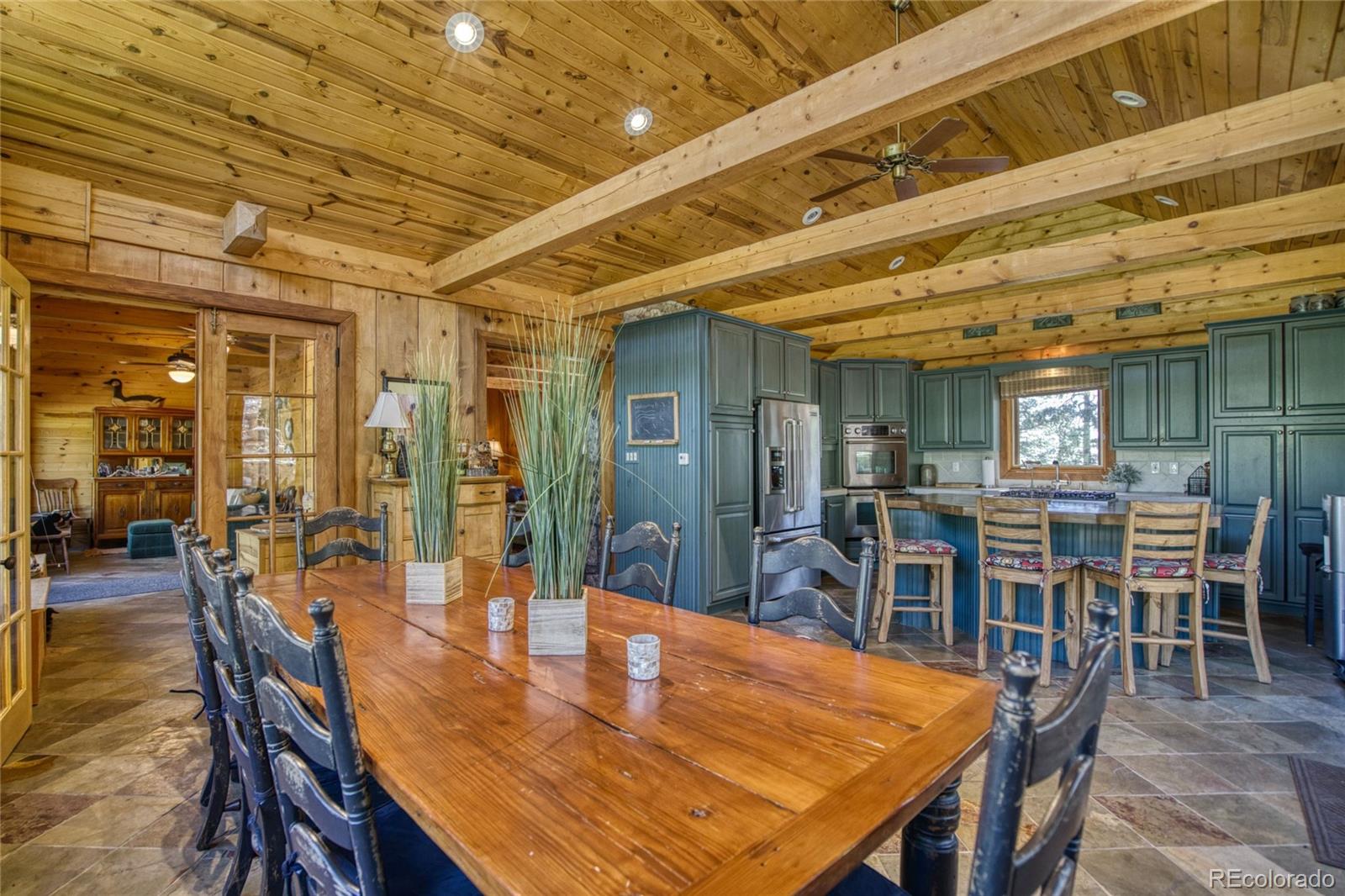 8555 Cuerna Verde Road Rye, CO 81069 - Photo 6 of 35 a dining room with a table and chairs