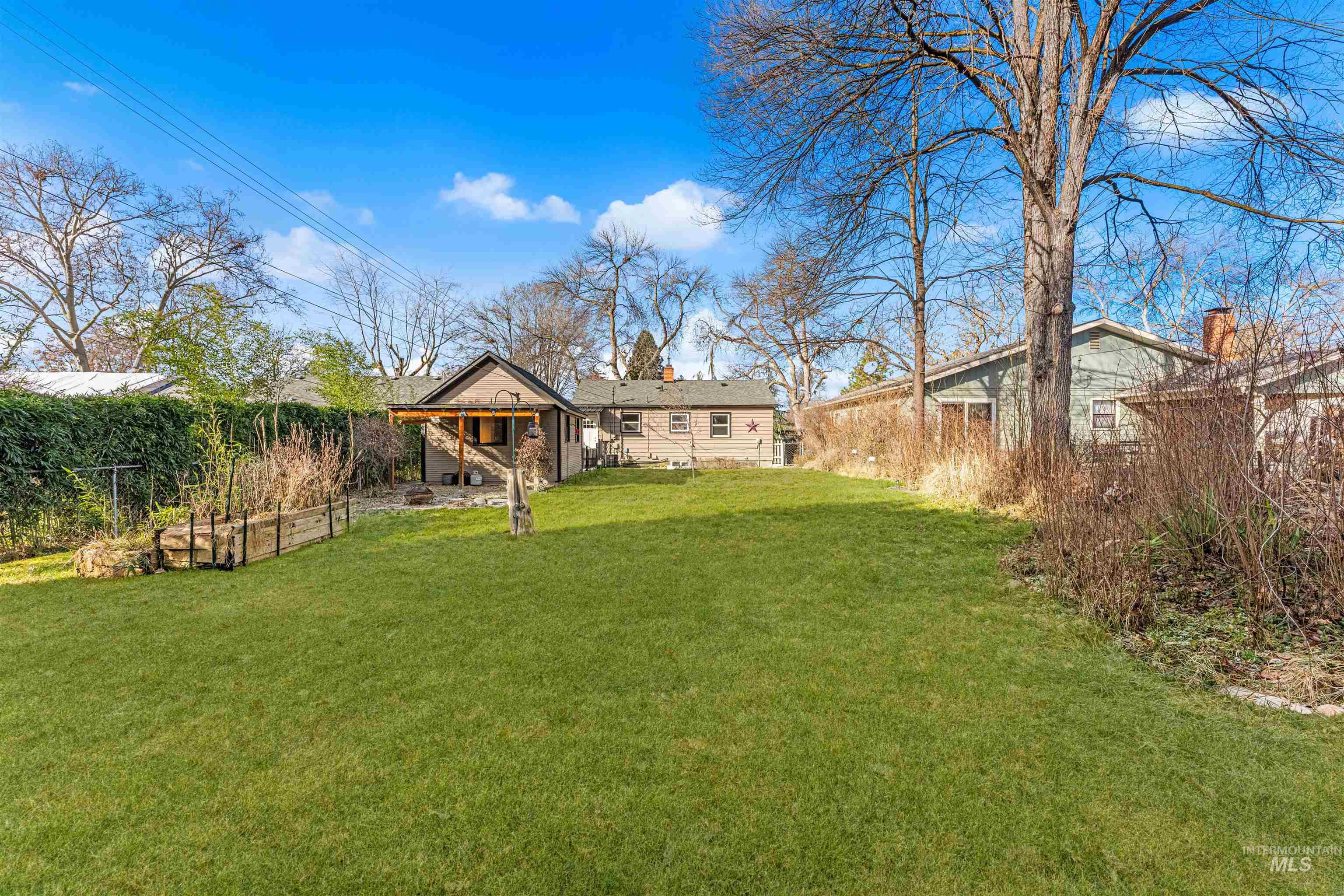 500 North Pacific Street Boise, ID 83706 - Photo 11 of 49 Fenced backyard featuring a vegetable garden
