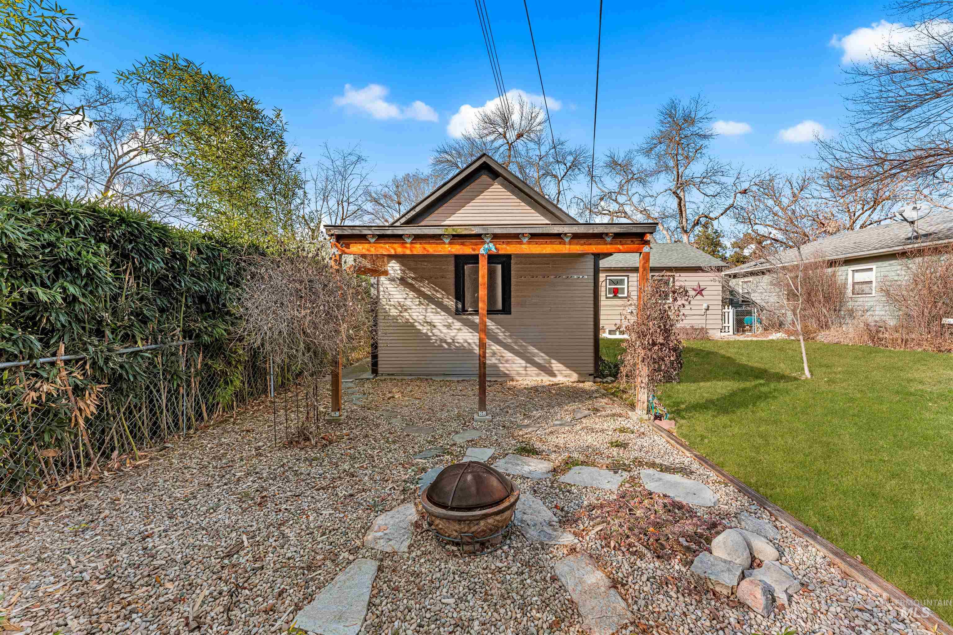 500 North Pacific Street Boise, ID 83706 - Photo 14 of 49 Rear view of property with a lawn, a fire pit, and a patio