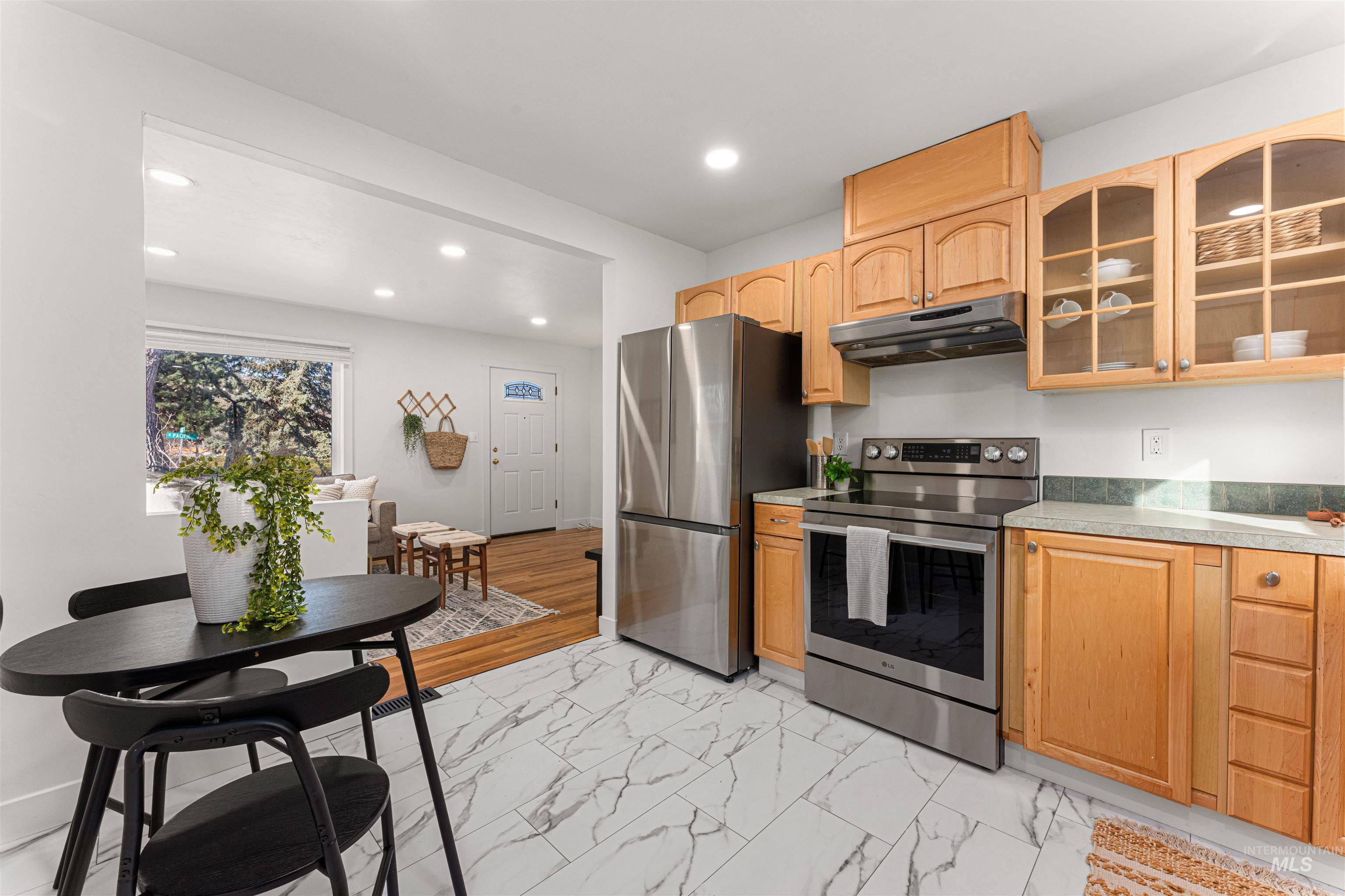 500 North Pacific Street Boise, ID 83706 - Photo 26 of 49 Bungalow-style house with a chimney, a shingled roof, and a front lawn