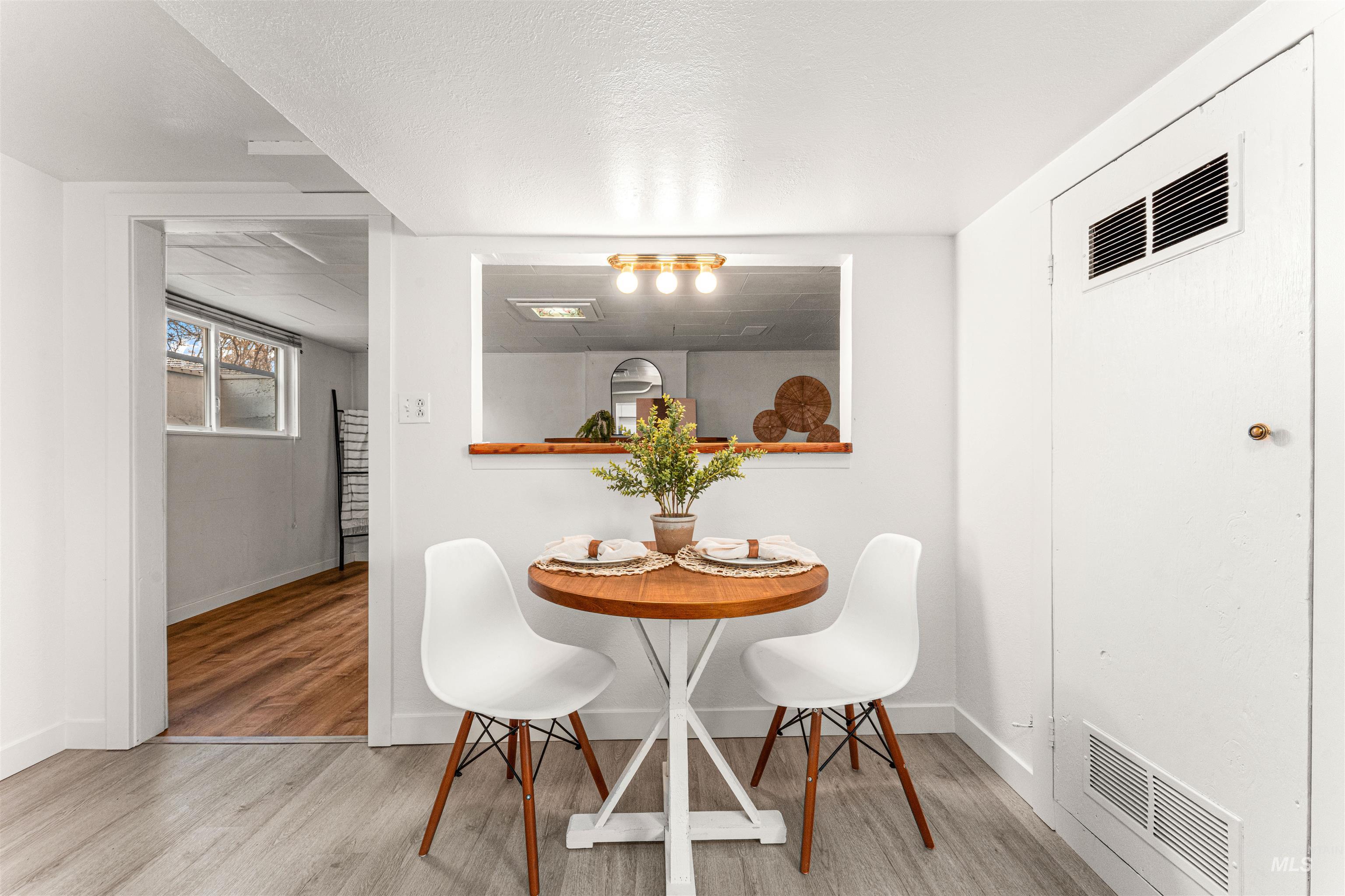 500 North Pacific Street Boise, ID 83706 - Photo 45 of 49 Unfurnished room with dark wood-style floors, wood walls, and a textured ceiling