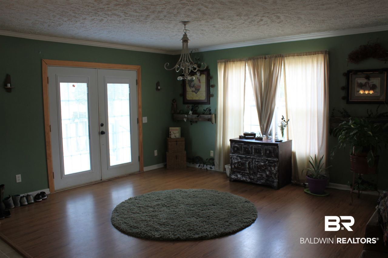 9380 Spice Pond Road Eight Mile, AL 36613 - Photo 20 of 36 Laminate flooring in dining/great room & kitchen.