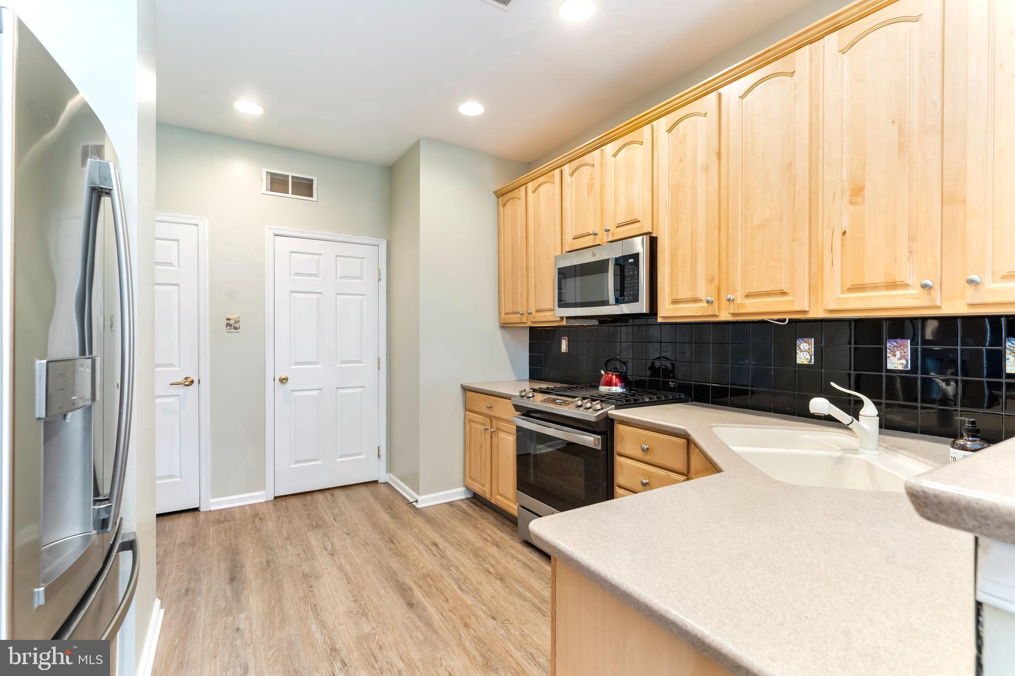 1302 Dawman Road Coatesville, PA 19320 - Photo 13 of 22 Kitchen to Laundry & Garage