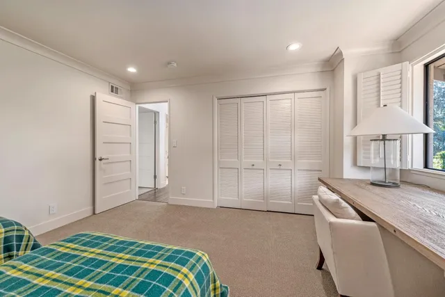 a bedroom with a bed and a cabinets