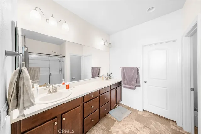 a spacious bathroom with a double vanity sink mirror and double
