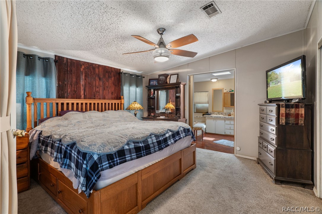 7927 West Cyprian Court Homosassa, FL 34448 - Photo 20 of 40 a bed sitting in a room next to a window