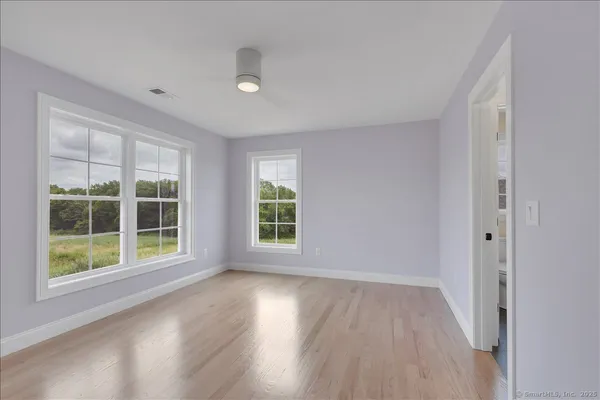 a view of room with window and hardwood floor