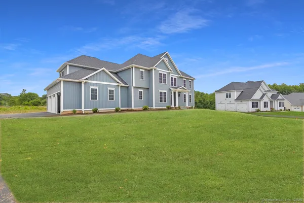 a front view of a house with a yard
