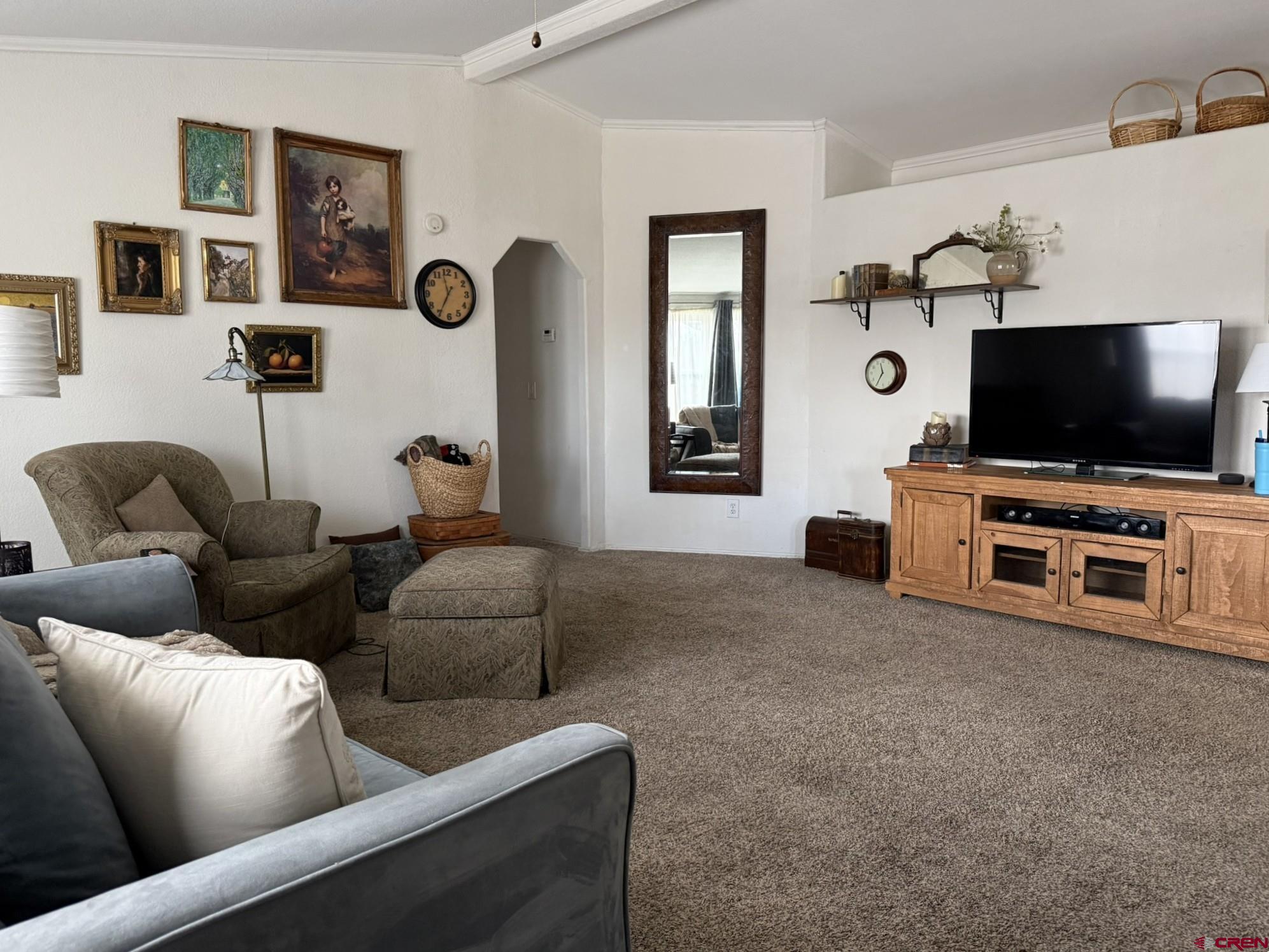 585 Elizabeth Street Delta, CO 81416 - Photo 2 of 36 a living room with furniture and a flat screen tv