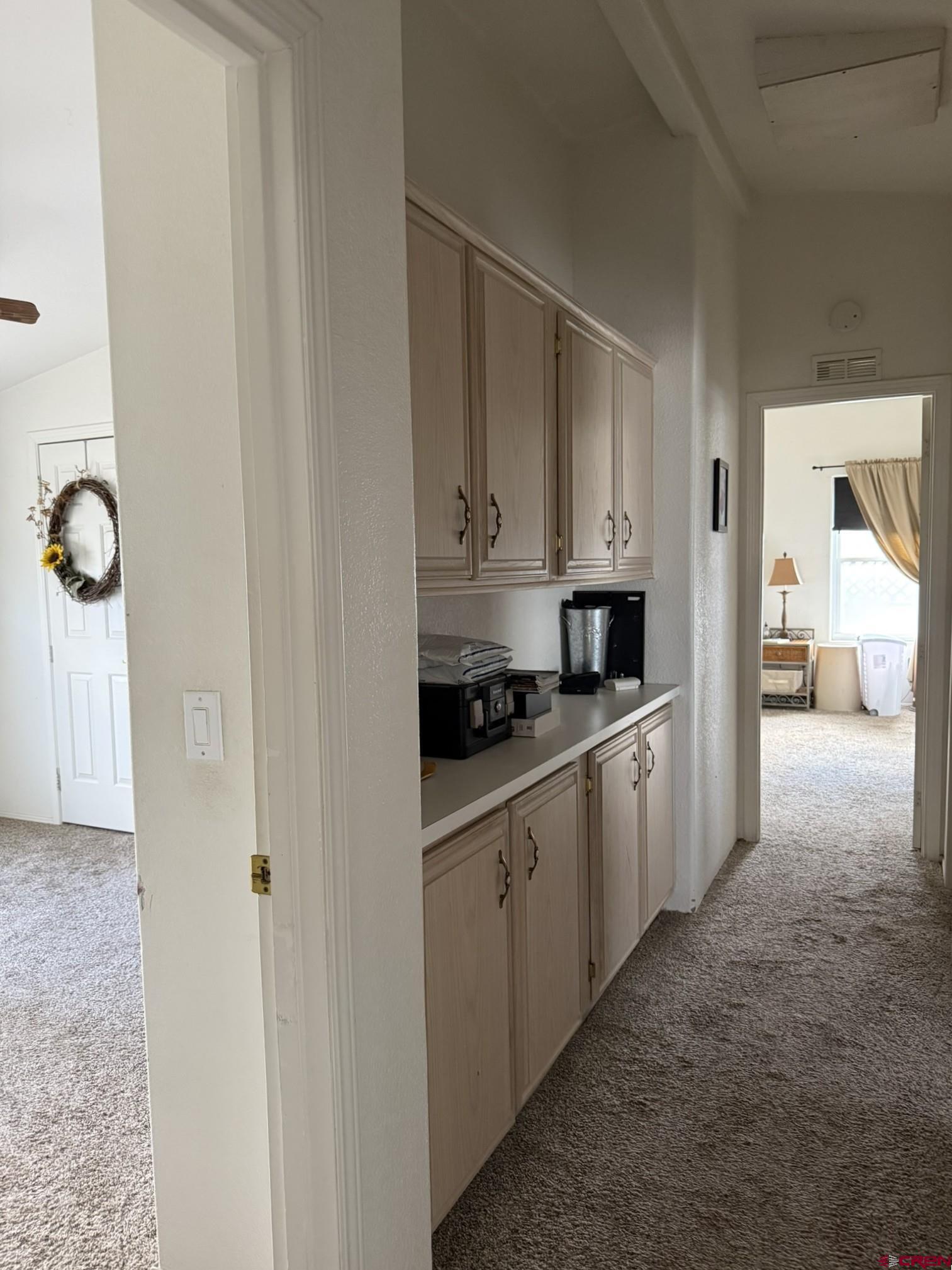 585 Elizabeth Street Delta, CO 81416 - Photo 21 of 36 a large white kitchen with granite countertop a sink