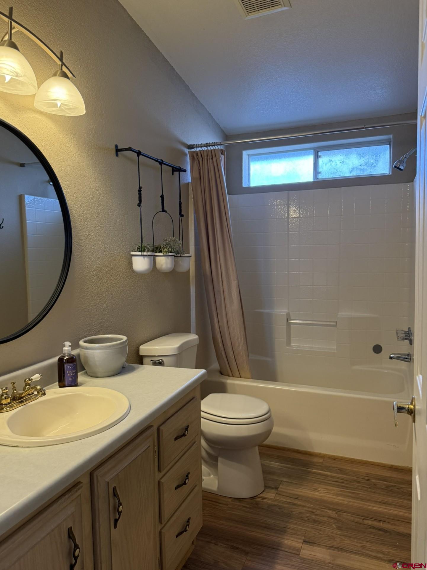 585 Elizabeth Street Delta, CO 81416 - Photo 23 of 36 a bathroom with a sink toilet and shower