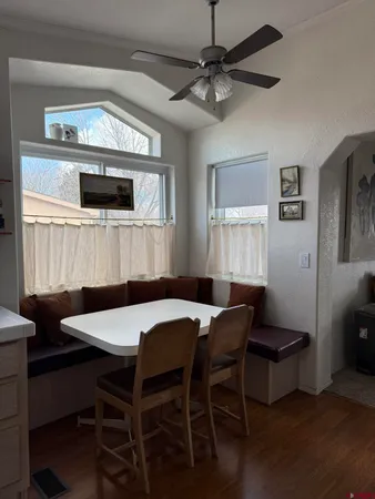 a kitchen with a stove a sink and a refrigerator