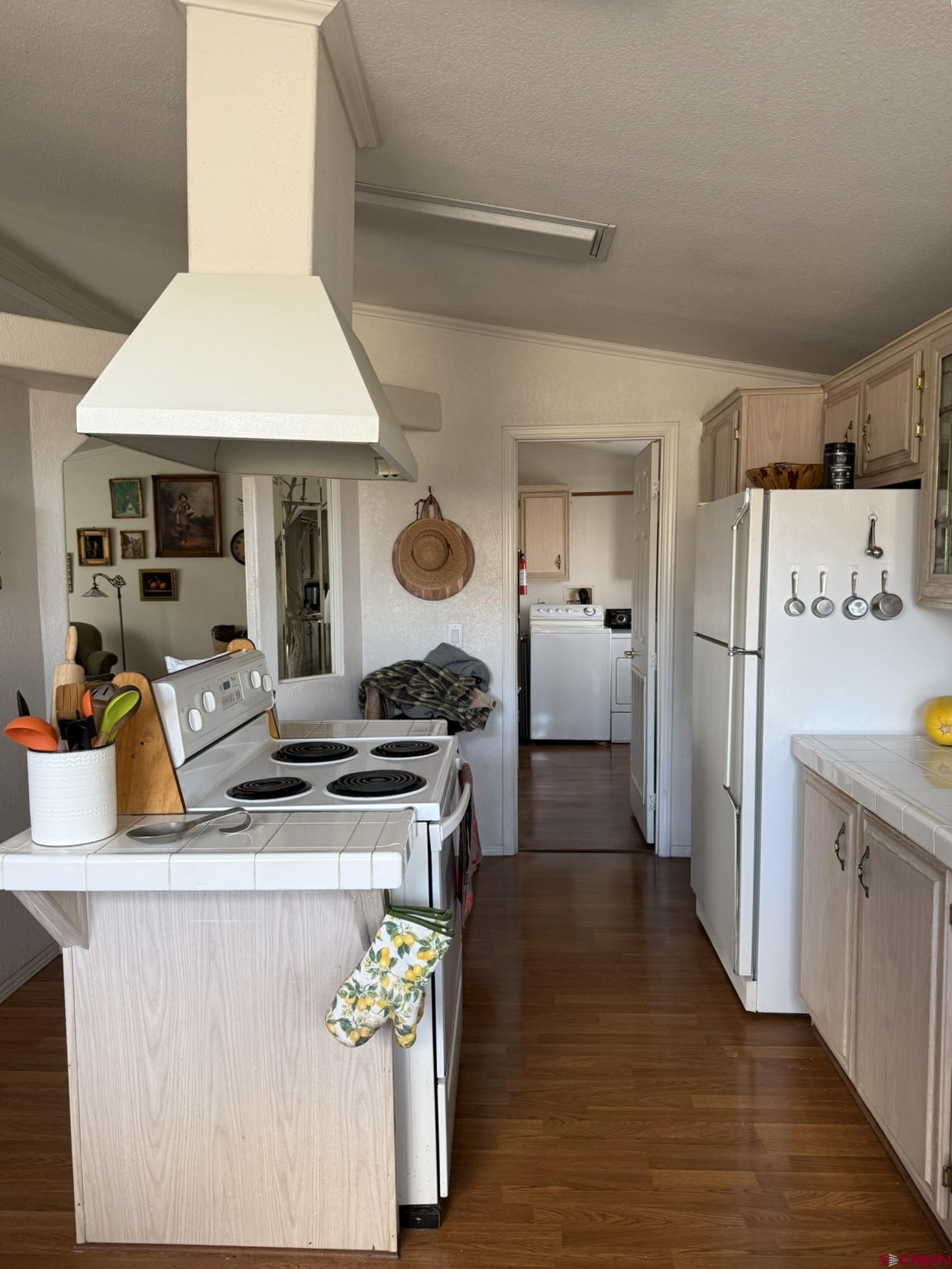 585 Elizabeth Street Delta, CO 81416 - Photo 8 of 36 a kitchen with stainless steel appliances granite countertop a stove a refrigerator and a refrigerator