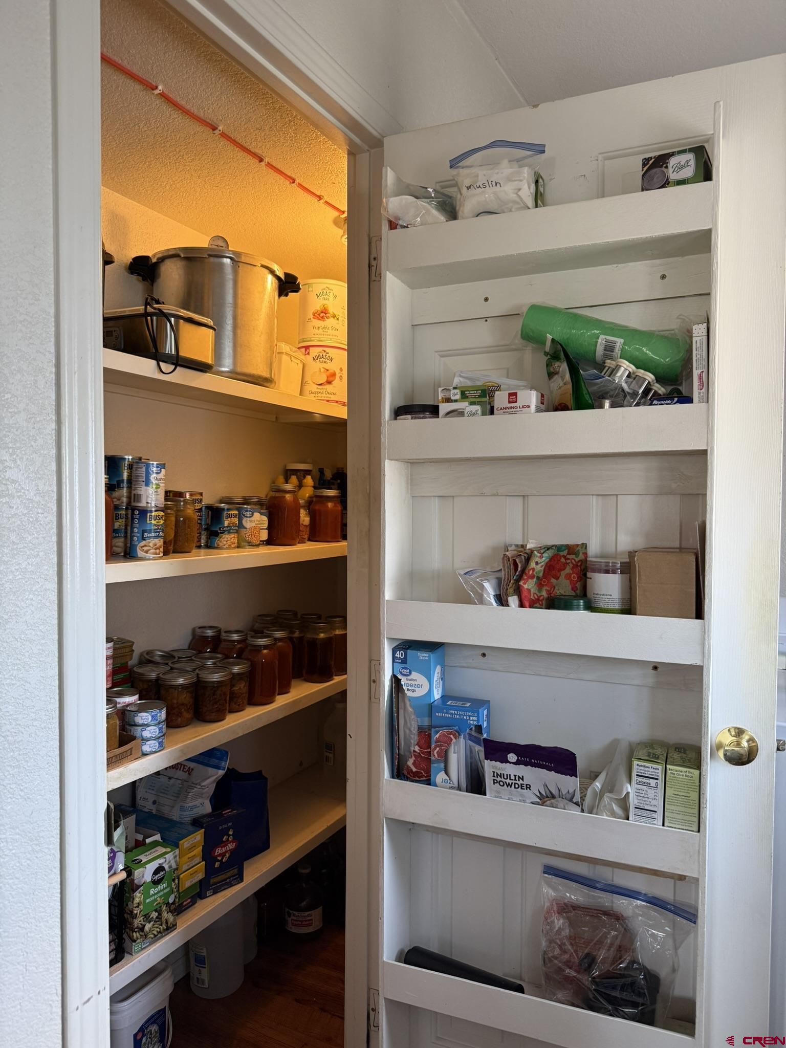 585 Elizabeth Street Delta, CO 81416 - Photo 10 of 36 a shelf with cup and plates