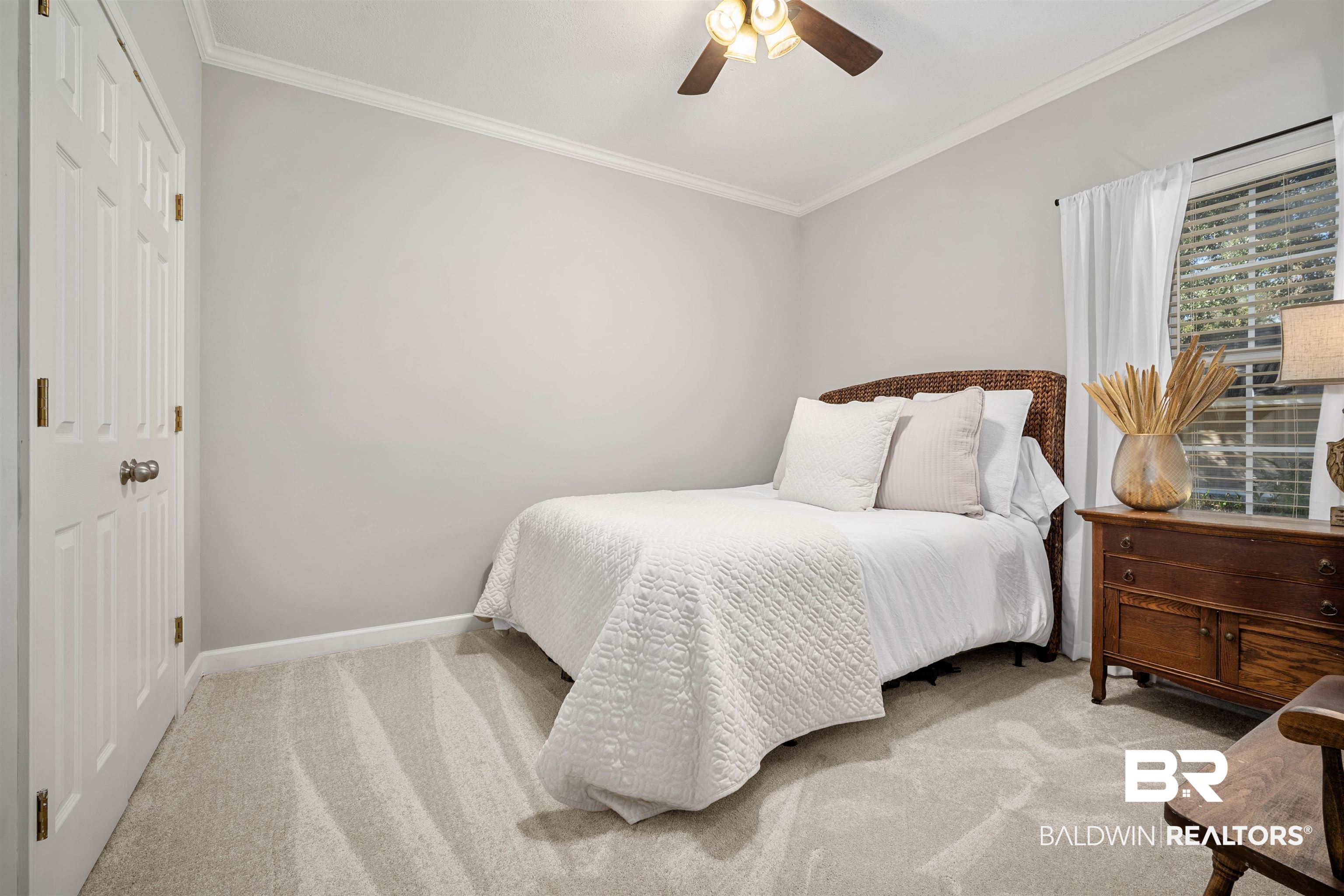 27288 Parker Lane Daphne, AL 36526 - Photo 17 of 29 Bedroom with light colored carpet, ornamental molding, a ceiling fan, and a closet