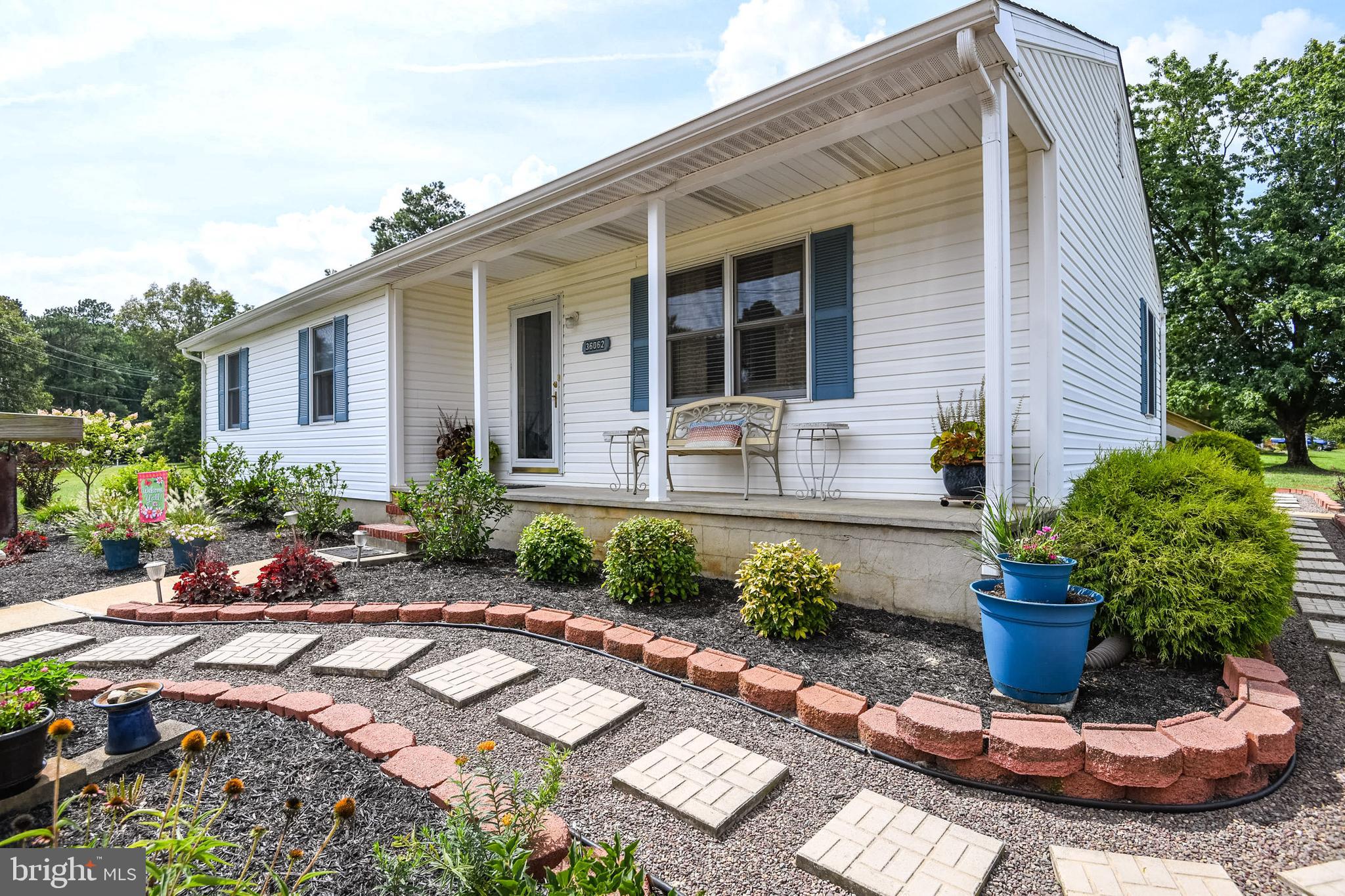 36062 Cobbs Hill Road Willards, MD 21874 - Photo 37 of 43 Front porch and paver walkway around the home