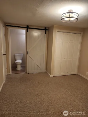 an empty room with a mirror