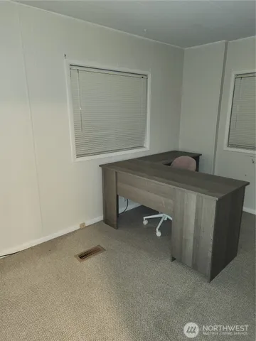 a room with a table and chairs