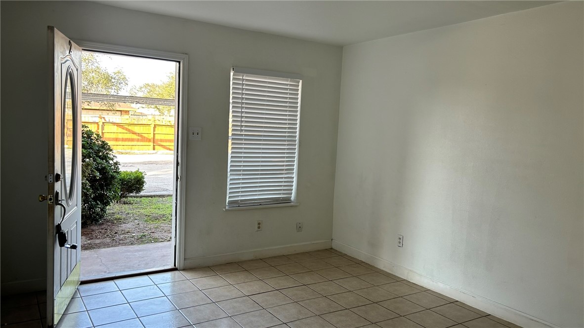 1004 Austin Street, Unit 2 Portland, TX 78374 - Photo 20 of 22 a view of an empty room and window