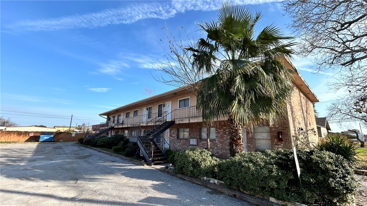 1004 Austin Street, Unit 2 Portland, TX 78374 - Photo 21 of 22 a front view of a house with balcony