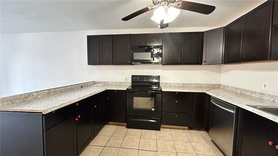 1004 Austin Street, Unit 2 Portland, TX 78374 - Photo 6 of 22 a kitchen with a sink and cabinets