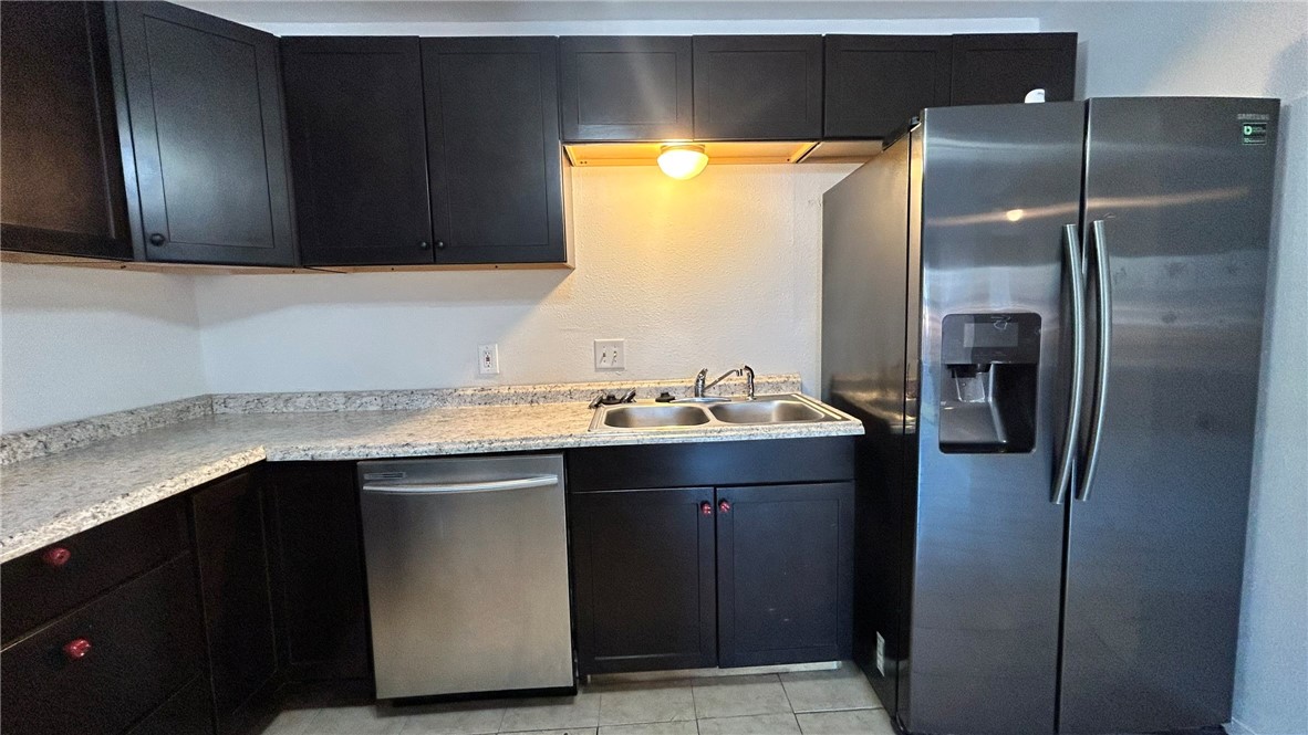 1004 Austin Street, Unit 2 Portland, TX 78374 - Photo 7 of 22 a bathroom with a sink and a mirror
