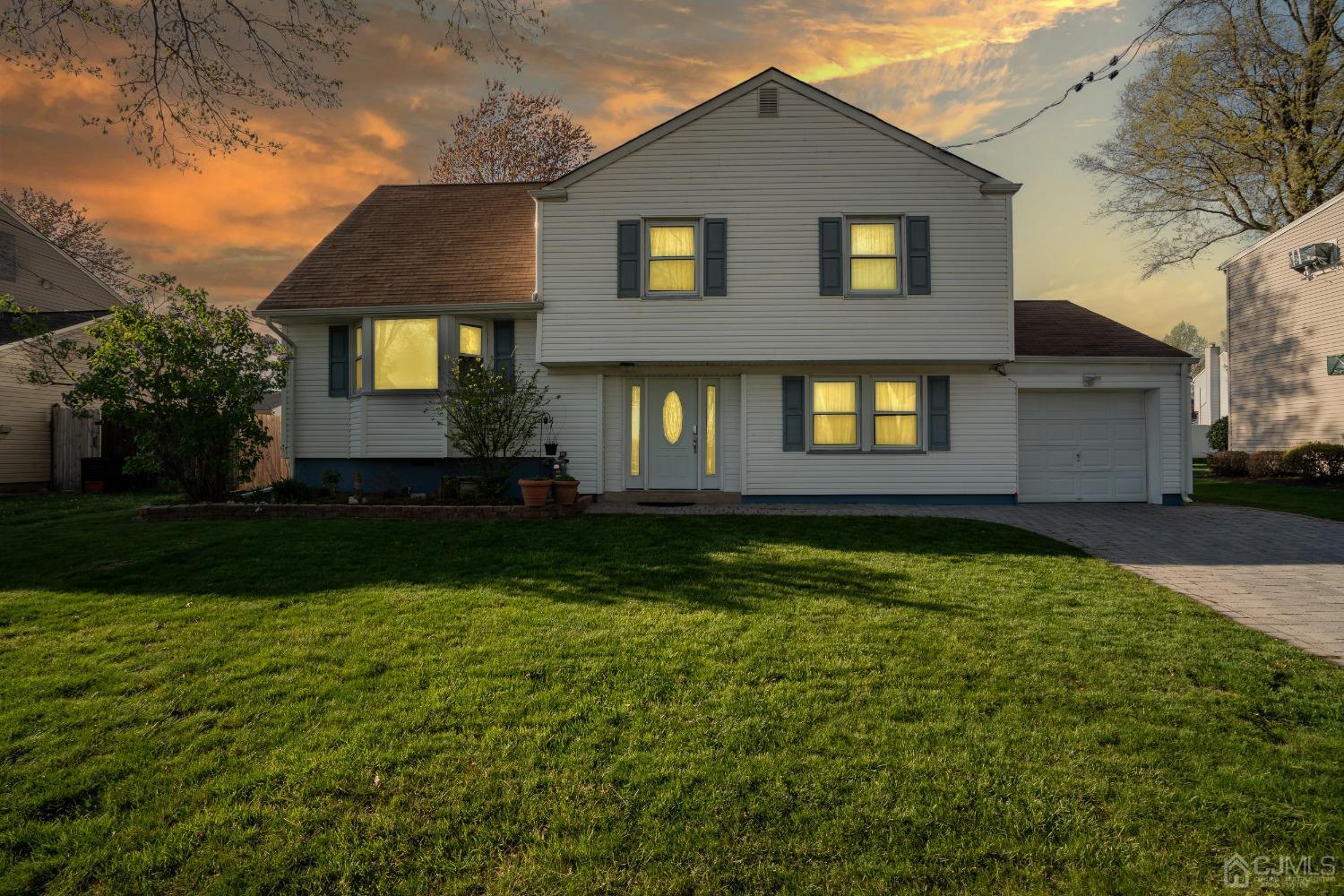 12 Meyer Road Edison, NJ 08817 - Photo 1 of 21 a front view of a house with garden