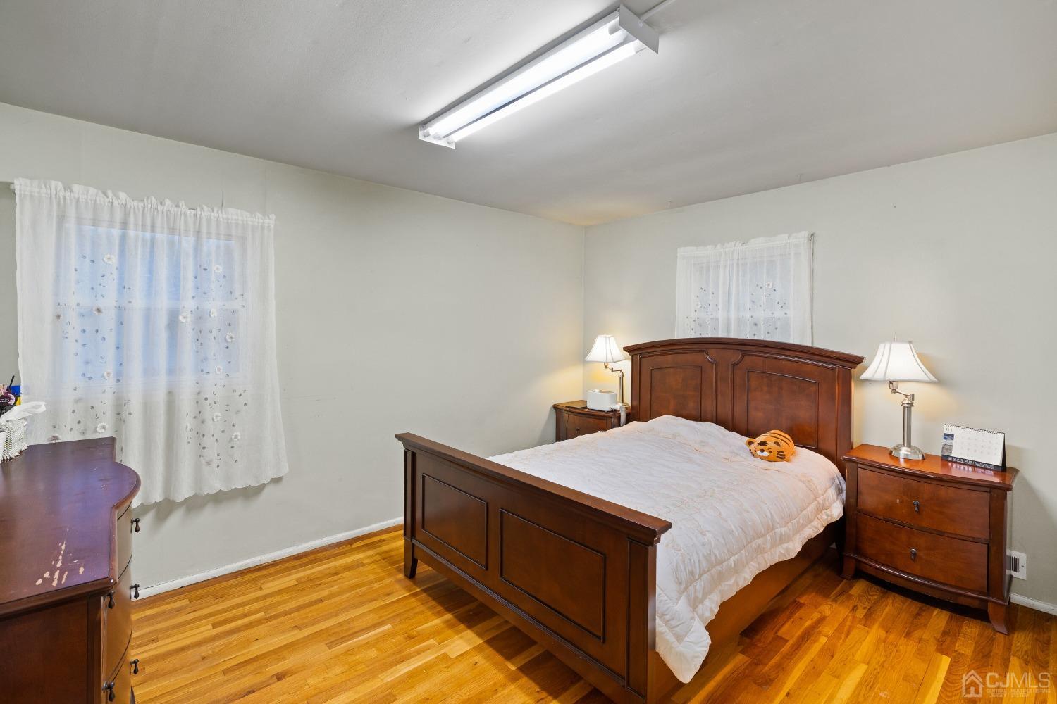 12 Meyer Road Edison, NJ 08817 - Photo 11 of 21 a bedroom with a bed and window