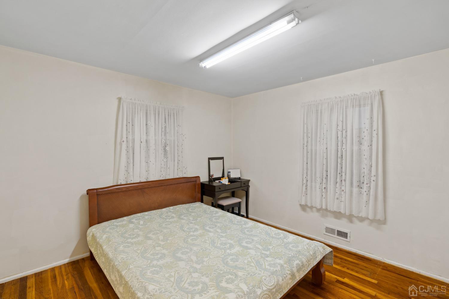 12 Meyer Road Edison, NJ 08817 - Photo 12 of 21 a bed room with a bed and a chair