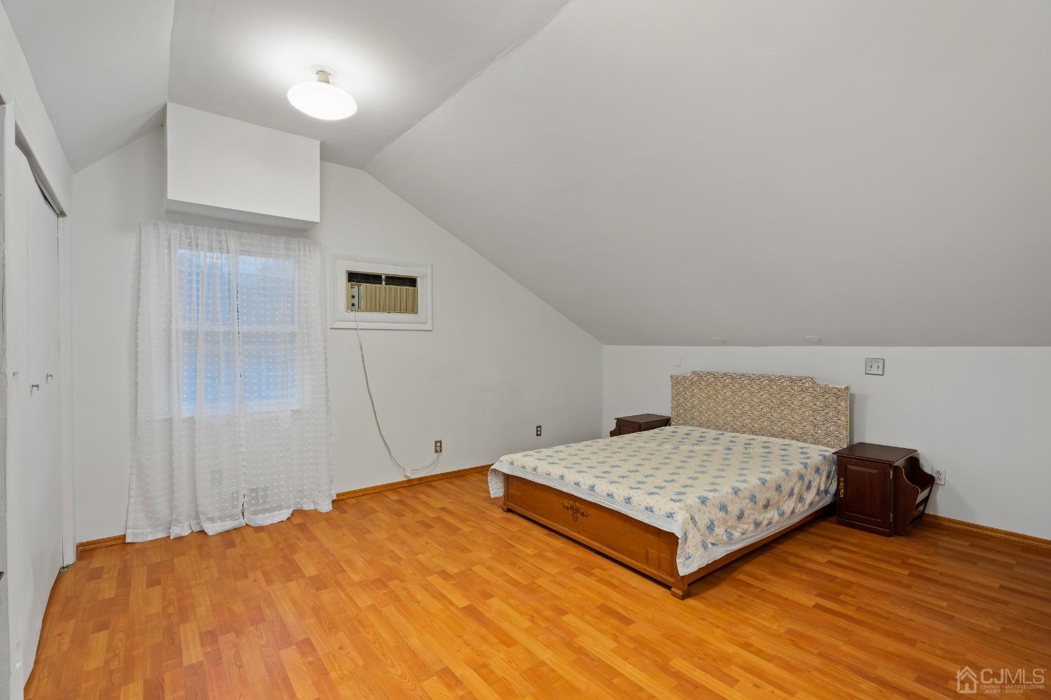 12 Meyer Road Edison, NJ 08817 - Photo 15 of 21 a bedroom with a bed and wooden floor