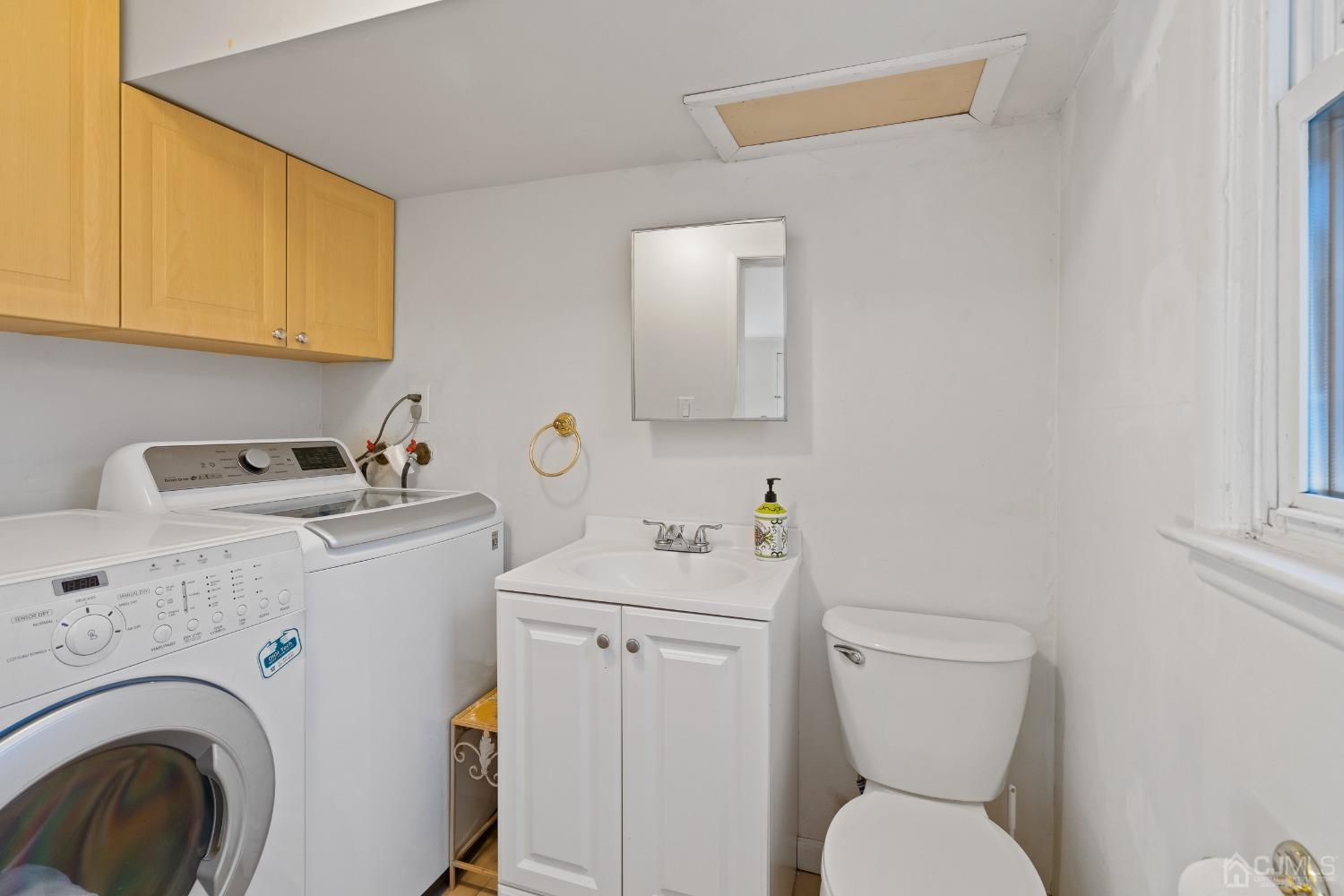 12 Meyer Road Edison, NJ 08817 - Photo 18 of 21 a bathroom with a sink toilet and a mirror