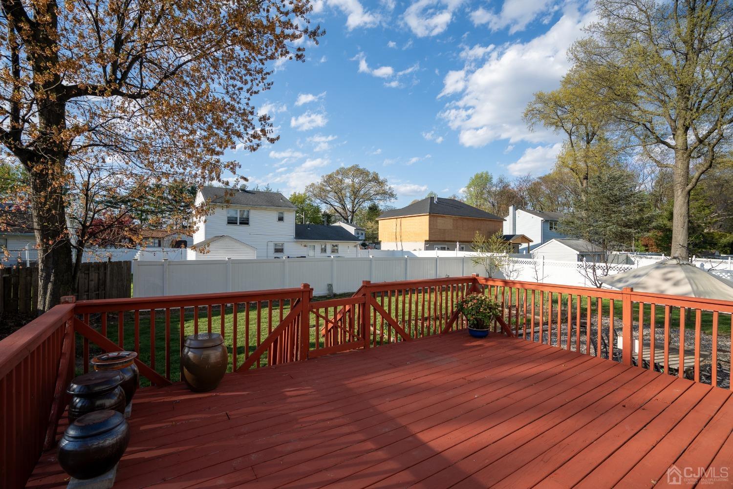12 Meyer Road Edison, NJ 08817 - Photo 19 of 21 a view of a balcony with wooden floor and fence