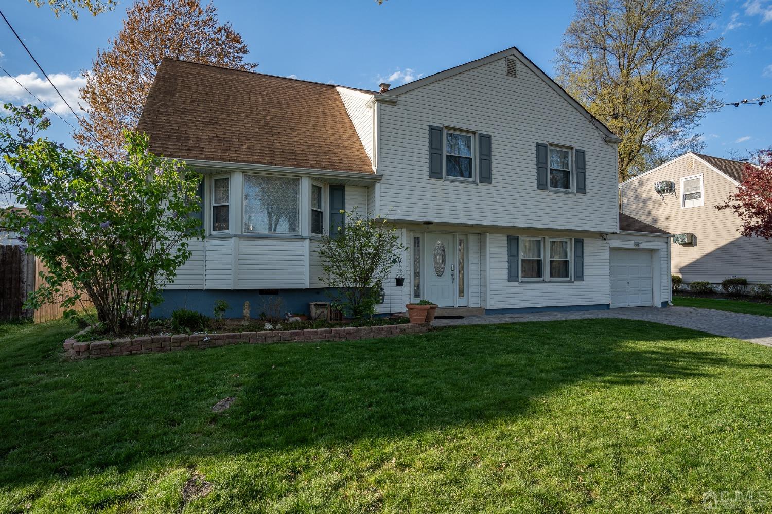 12 Meyer Road Edison, NJ 08817 - Photo 2 of 21 a front view of a house with a garden