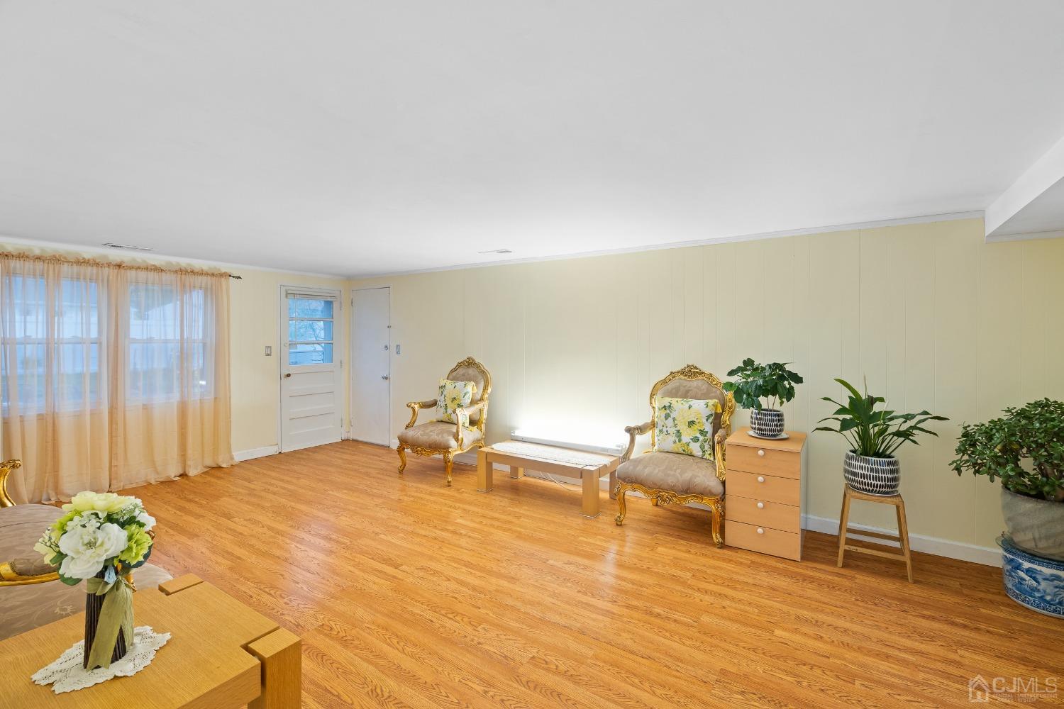 12 Meyer Road Edison, NJ 08817 - Photo 5 of 21 a living room with furniture and flowers