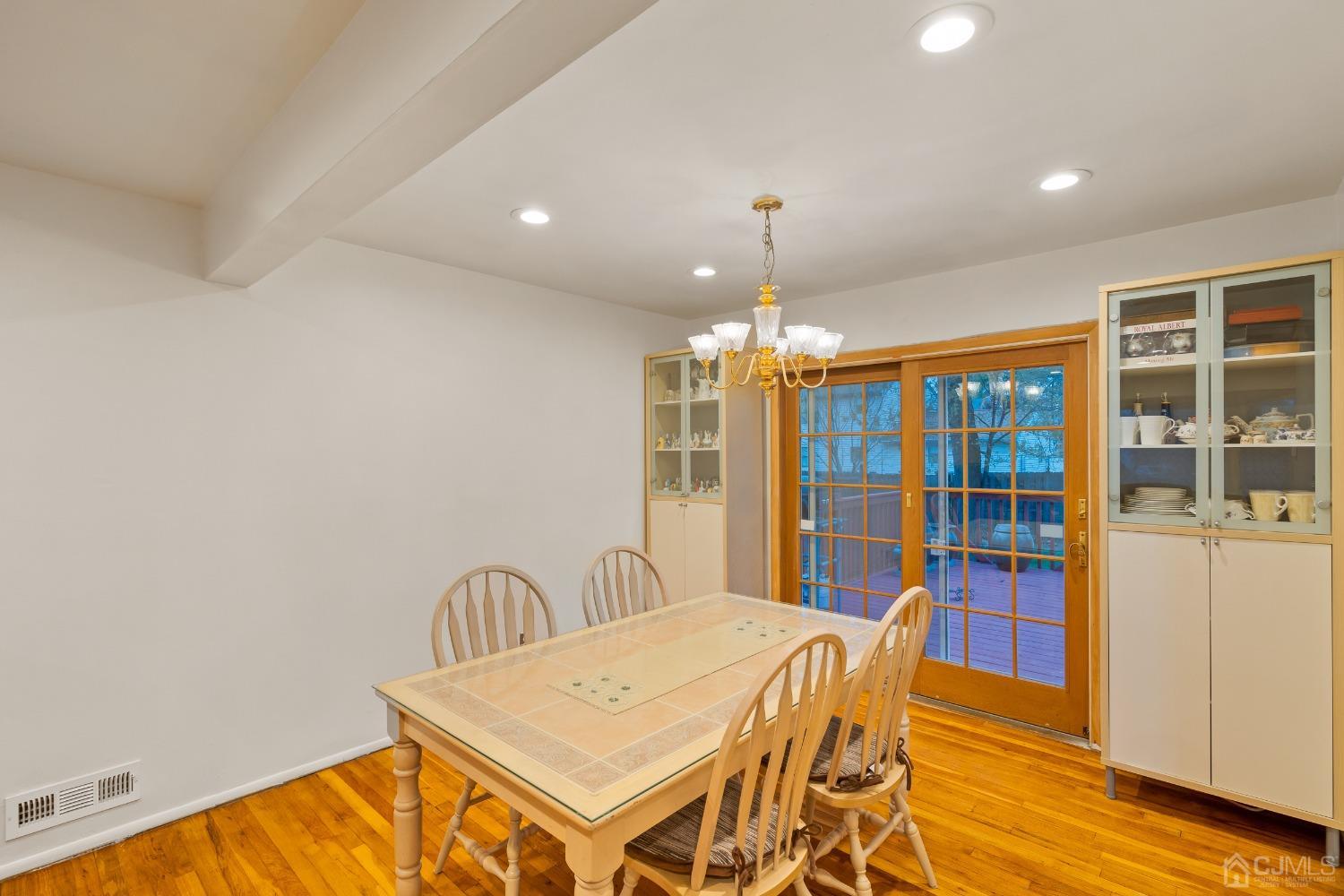 12 Meyer Road Edison, NJ 08817 - Photo 8 of 21 a view of a dining room with furniture wooden floor and chandelier