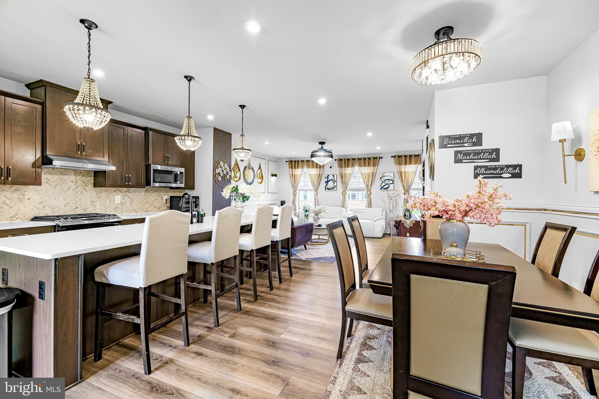 109 Torrey Drive Newark, DE 19702 - Photo 12 of 49 a dining room with furniture a chandelier and wooden floor