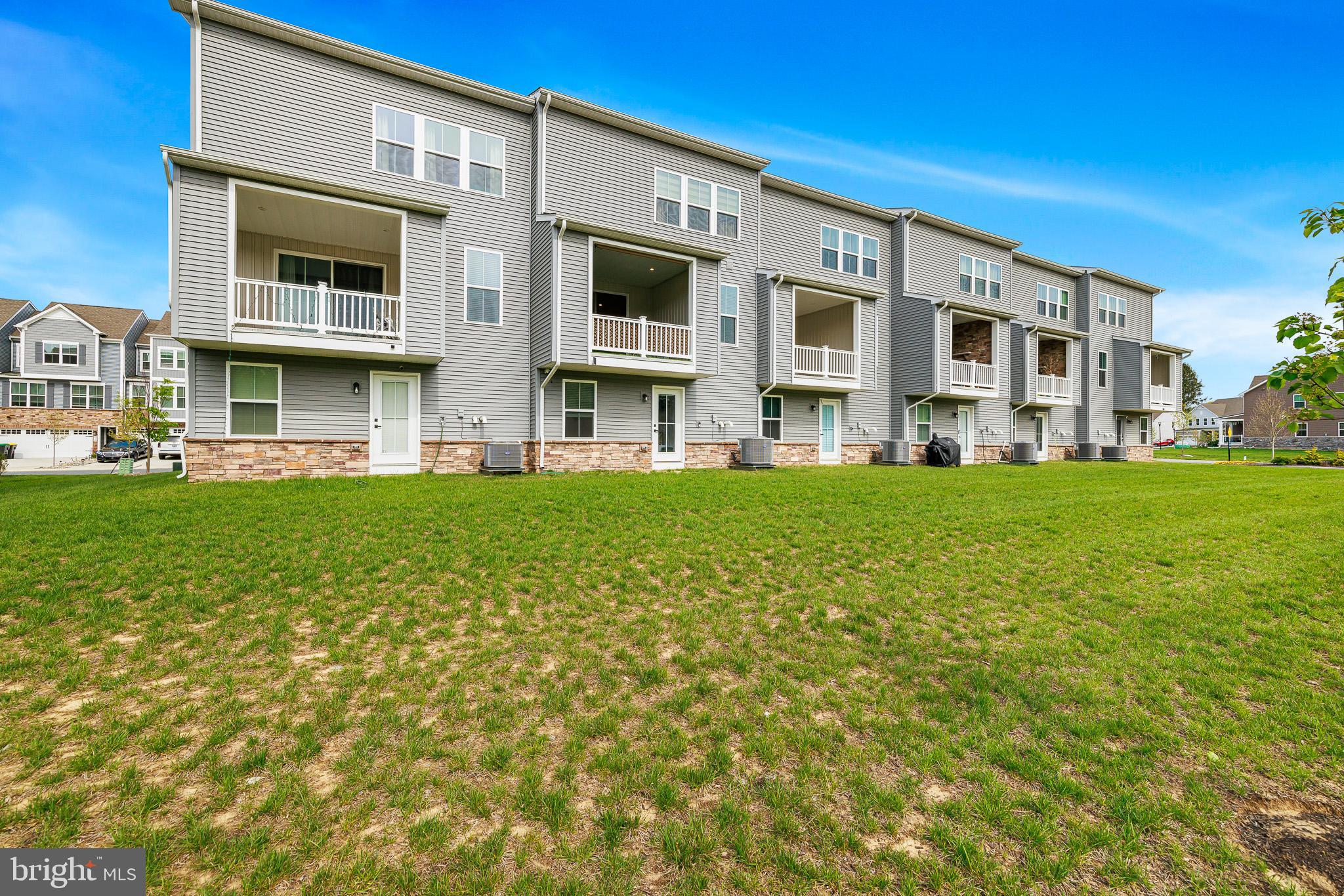 109 Torrey Drive Newark, DE 19702 - Photo 22 of 49 a front view of building with yard