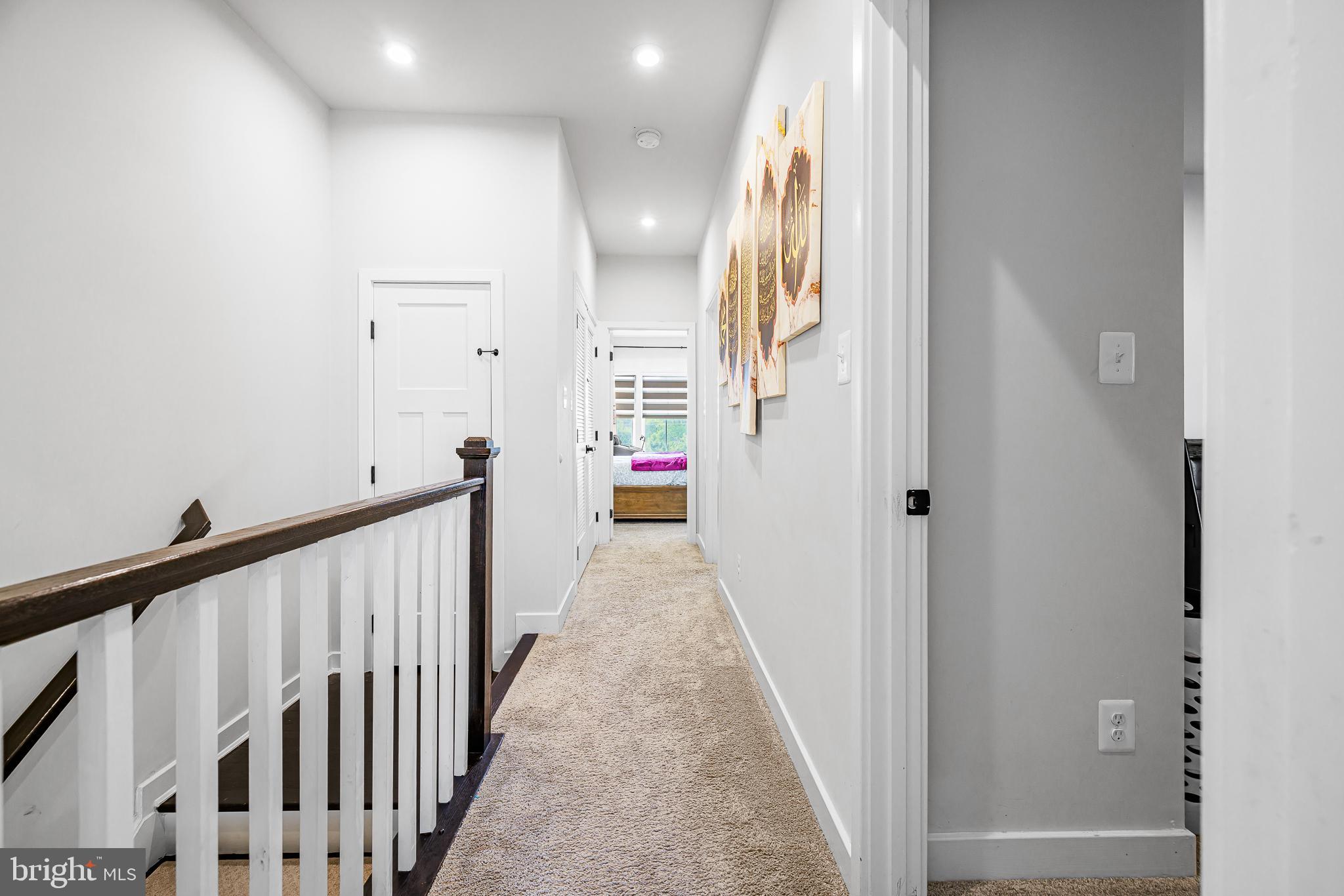 109 Torrey Drive Newark, DE 19702 - Photo 25 of 49 a view of a hallway with wooden floor and staircase