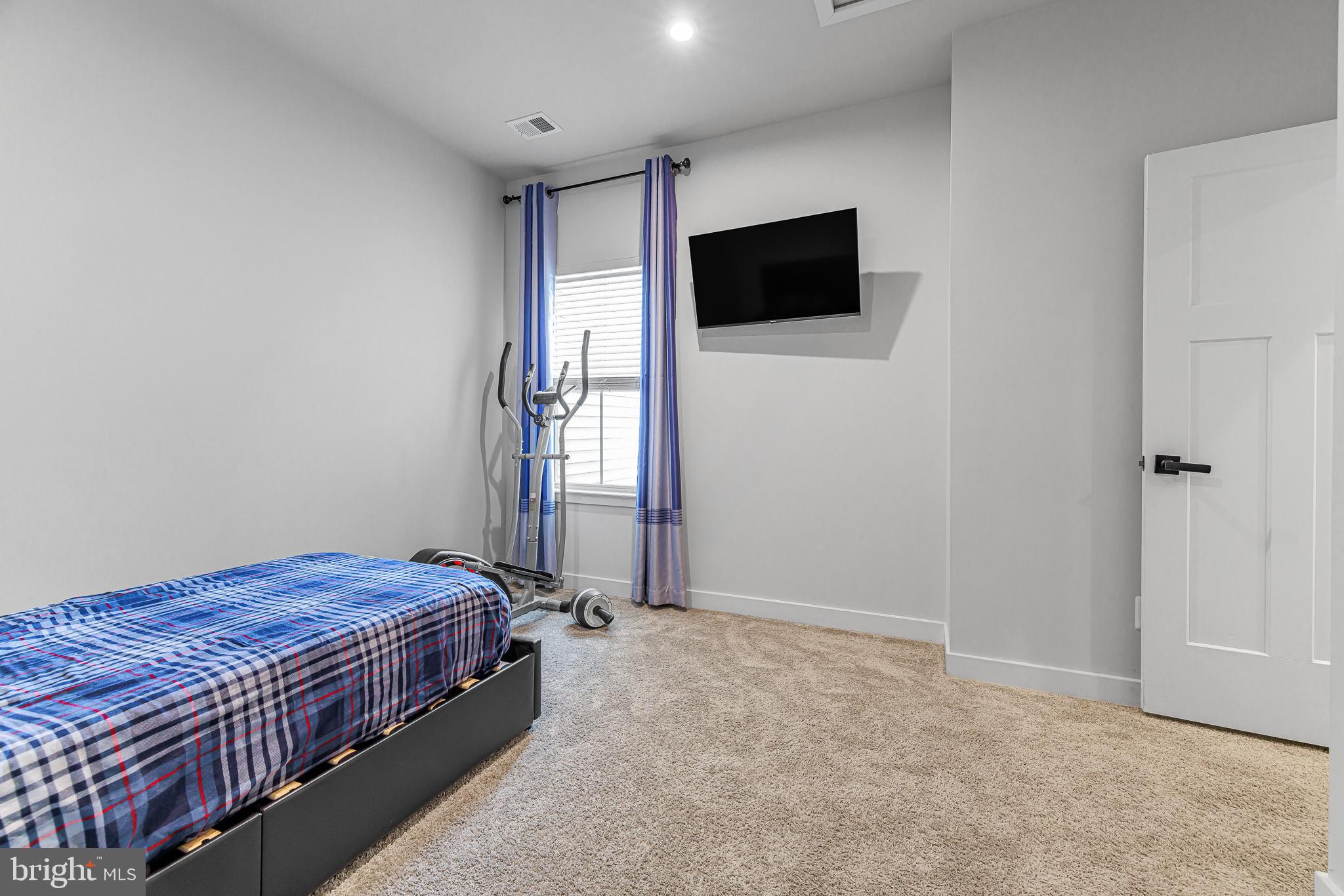 109 Torrey Drive Newark, DE 19702 - Photo 33 of 49 a bedroom with a bed and a flat screen tv