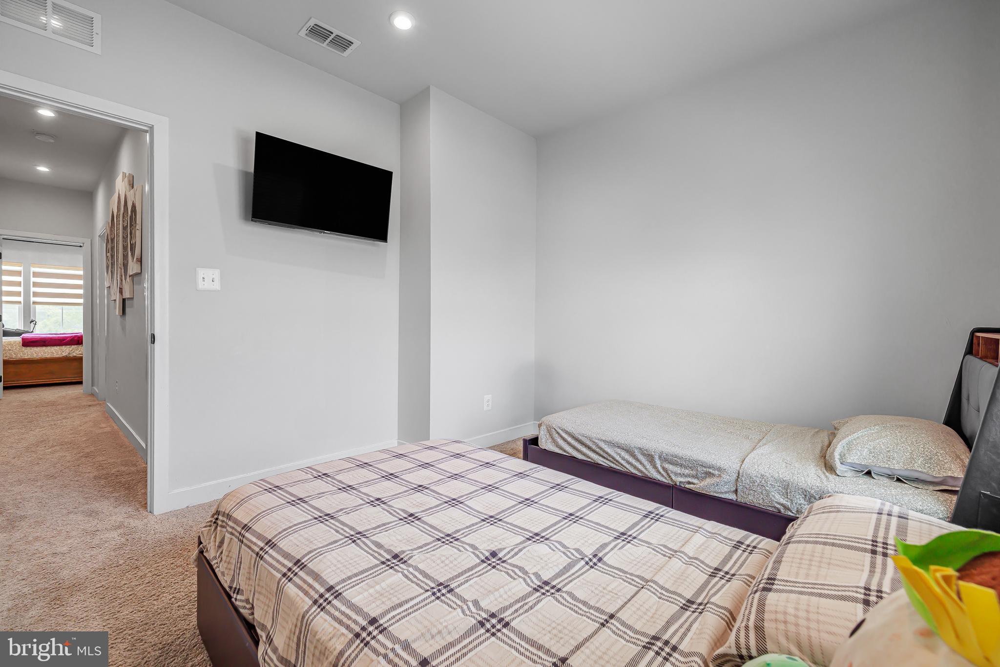 109 Torrey Drive Newark, DE 19702 - Photo 35 of 49 a bedroom with a bed and a flat screen tv