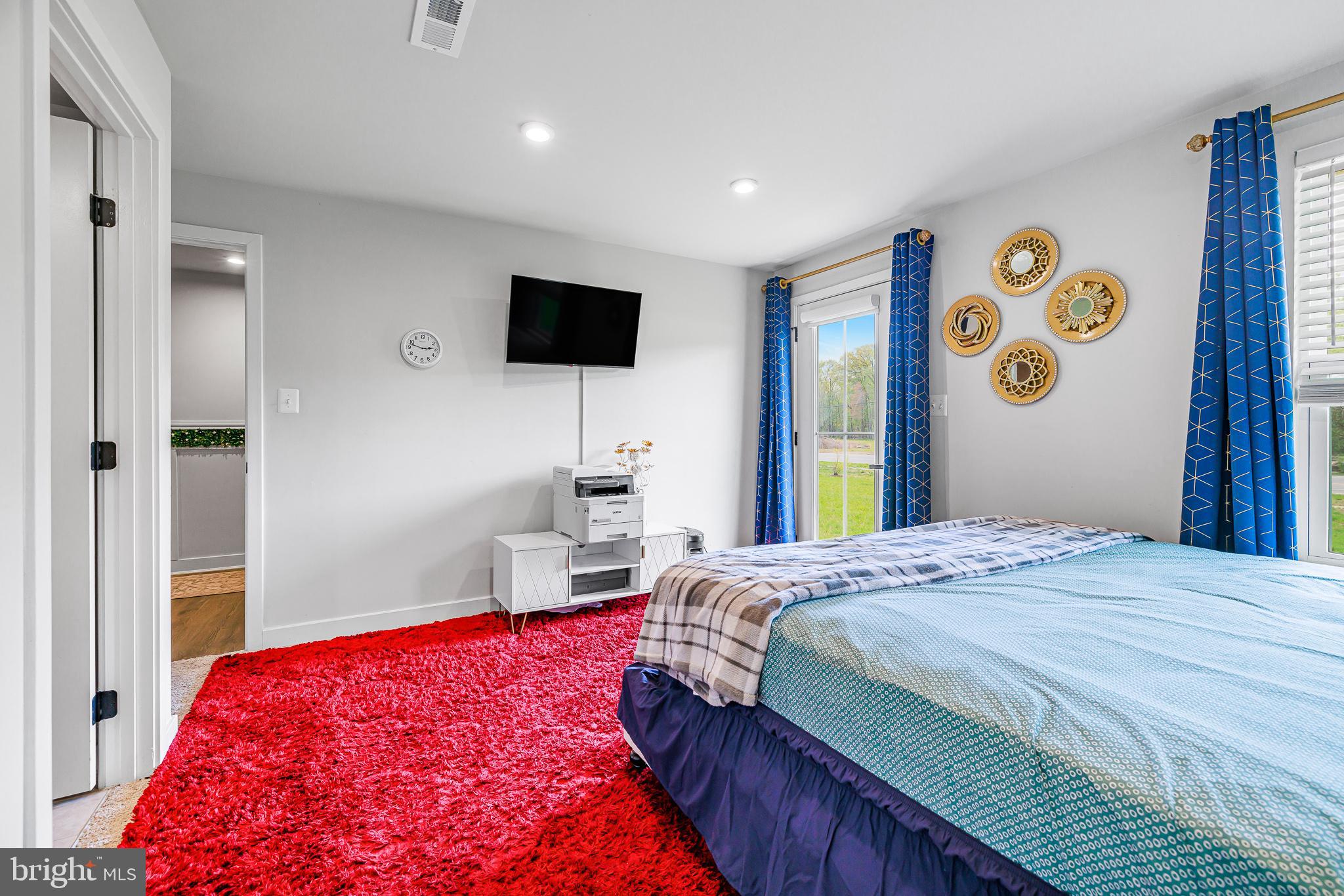 109 Torrey Drive Newark, DE 19702 - Photo 7 of 49 a bedroom with a bed and a flat screen tv