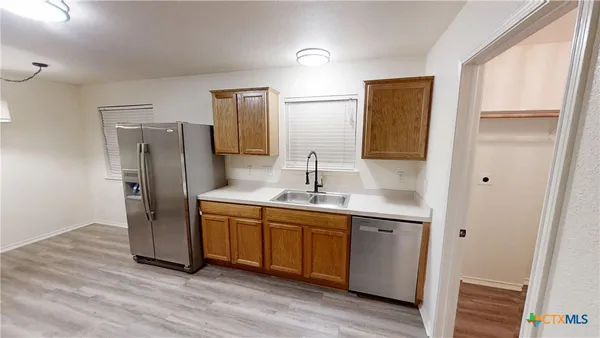 a bathroom with a double vanity sink and mirror