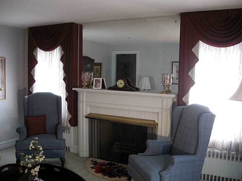58 Briarcliffe Road Cranston, RI 02910 - Photo 9 of 25 Living Room. A wonderful space to enjoy a quiet visit or your favorite author in front of the fire.